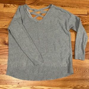 Gray body cut sweater with crisscross detail on back
